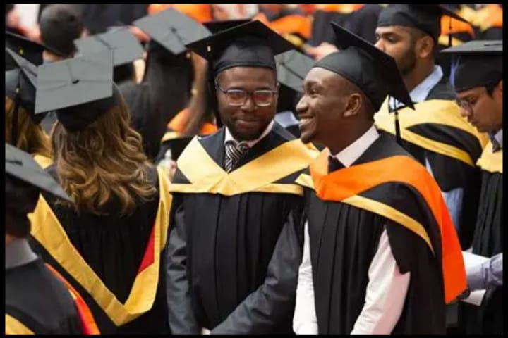 Men on graduation unifrom.